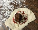 A picture of step 4 of Cheesy garlic bread meatball ring.