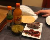 A picture of step 3 of Beef Sirloin Tacos with Roasted Peppers and Green Tomatillo Salsa with Spicy Sauce.