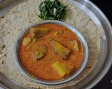 A picture of step 3 of Jowar Bhakri with brinjal potato vegetable curry.