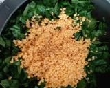 A picture of step 2 of Moogdal with spinach.