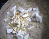 A picture of step 6 of Shahi paneer with white gravy.