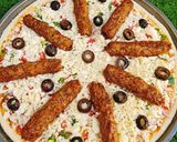 A picture of step 4 of Chicken Kabab Pizza 🍕🍕.