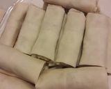 A picture of step 9 of Curry chicken spring rolls.