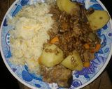 A picture of step 9 of Carroted rice with special ndengu and beef.