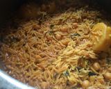 A picture of step 8 of Aloo chane ki tahiri.