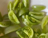 A picture of step 1 of Green tomato pickle (Lila tomatanu athanu).
