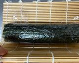 A picture of step 8 of Mickey Mouse Roll Sushi.