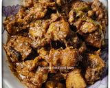 A picture of step 10 of Dahi chicken.