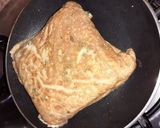 A picture of step 4 of Eggs wrapped Pasta Sandwich.