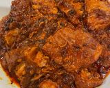 A picture of step 5 of Braised Pork with Tomato Sauce.