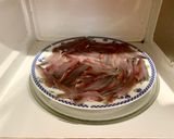 A picture of step 5 of Microwave Marinated Anchovies with Olive Oil, Lemon, Salt, and Pepper.