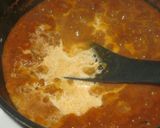 A picture of step 4 of Coconut fish curry.