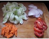 A picture of step 1 of Tomato, Carrot and Cucumber Salad.