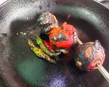A picture of step 1 of Lonka Roshun Pora Masala Chicken.