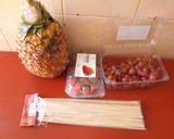 A picture of step 2 of Edible fruit arrangement on a pineapple boat.