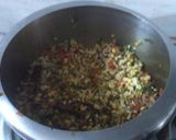 A picture of step 3 of Palak panch dal khichdi tempered with burnt garlic.