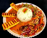 A picture of step 4 of Spicy Grilled Paneer Steak Italian Herb Rice Schezwan Sauce With Exotic Sautéed Veggies Gourmet Meal.