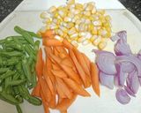 A picture of step 3 of Corn & Vegetable Tawa Rice.