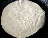 A picture of step 7 of Kheer'r Patishapta pithe (a traditional Bengali sweet delicacy).