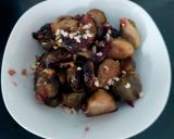 A picture of step 4 of My Roasted Sprouts in orange,crushed Walnuts and Cranberry sauce.