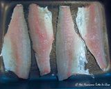 Foto del passaggio 4 della ricetta Filetti di Branzino in crosta di frutta secca con patate "Sabbiate"