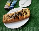 A picture of step 11 of Oreo vanillah cake loaf.