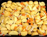 A picture of step 2 of Chicken thighs in "onion" mayonnaise with vegetables, in the oven.