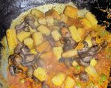 A picture of step 6 of Mushroom Baby Corn Curry.
