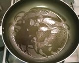 A picture of step 12 of Paneer wrapped in banana leaf.