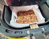 A picture of step 4 of Mixed seeds savoury chikki made in Air fryer.