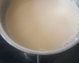 A picture of step 2 of Red Tea with Milk, Cloves, and Cardamom.