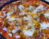 A picture of step 8 of Chicken tikka pizza.