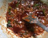 A picture of step 6 of Chatpata Bread Upma in red sauce.