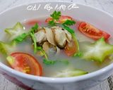 Hình bước làm 2 của món Canh nghêu nấu khế cà chua