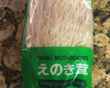 A picture of step 1 of Enoki mushrooms and cucumber with umeboshi flavored ponzu dressing.