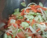A picture of step 12 of Tomato rice with chicken and salad.