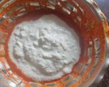 A picture of step 4 of Smokey tandoori chicken drumsticks biryani with mint mango raita.
