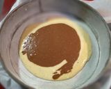 Foto del paso 7 de la receta Bizcocho cebra borracho de naranja y chocolate