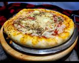 A picture of step 4 of Paneer and onion pizza.