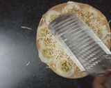 A picture of step 4 of Sandwich pizza from leftover Roti.