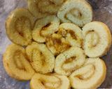A picture of step 8 of Peach Swiss roll Ice cream Cake.