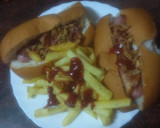 Foto del paso 7 de la receta: Perrito de salchicha fresca envuelta con papas fritas