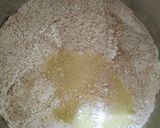 A picture of step 4 of Eggless Layered chocolate strawberry orange cake.