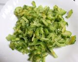 A picture of step 1 of Kakarakaya Vepudu (Bitter Gourd Stir Fry - Andhra Style).