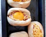 A picture of step 3 of My Cheesey Bacon & Egg in a bread basket. 😁.