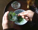 Preparing a cup of Matcha on a table recipe step 5 photo