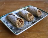 A picture of step 5 of Baked Hazelnut Cannoli with Coffee Cream.