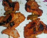 A picture of step 6 of Chicken tikka made in a pan.