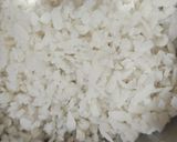 A picture of step 1 of Atukulu with coconut and cucumber in south style.