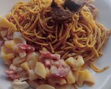 A picture of step 6 of Jollof spaghetti with beef and potato salad.